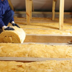 laying-a-roll-of-loft-insulation